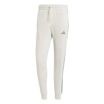 Image of adidas Men&#039;s Essentials Fleece 3 Stripes Tapered Cuff Pants, Alumina, S