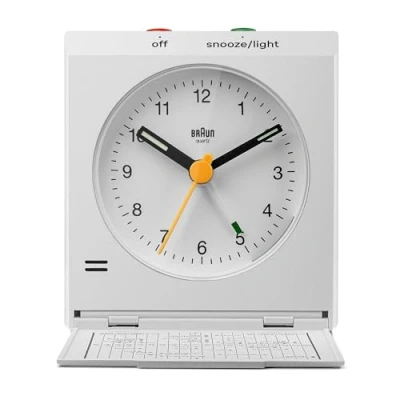 Image of Braun Classic Analogue Travel Alarm Clock with Snooze and Light, Iconic Design, Compact Size, Folding Lid World Time Zone Map, Quiet Quartz Movement, Crescendo Beep in White, model BC05W