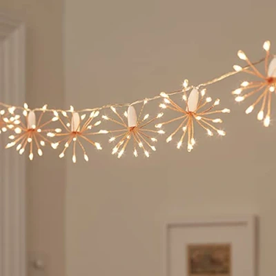 Image of Lights4fun Rose Gold Starburst Chain Fairy String Lights with Timer 300 Warm White Micro LEDs Plug in for Indoor Use 3m