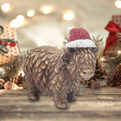 Image of Lesser &amp; Pavey Christmas Highland Cow Figurine with Santa Hat 12cm x 9cm Gift Idea for Xmas Decoration Themed Décor Perfect Home Kitchen Tabletop UK Design