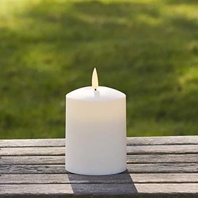 Image of Lights4fun TruGlow® Small Outdoor Waterproof Flameless LED Pillar Candle Battery Operated with Timer 10cm