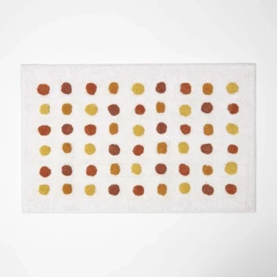 Image of HOMESCAPES Mustard and White Cotton Bath Mat with Polka Dot Design Super Absorbent Tufted Bathmat, 50 x 80 cm