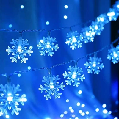 Image of Christmas Lights, 20 Ft 40 LED Blue Snowflake String Lights Battery Operated Fairy Hanging Garland for Bedroom Patio Room Party Home Xmas Decor Indoor Outdoor Tree Decorations
