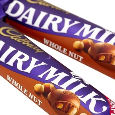 Image of Cadbury Dairy Milk Chocolate Whole Nut Single Bar Pack of 24 Delicious Smooth with Crunchy Hazelnuts. Sold by ESSENTIAL PRODUCTS