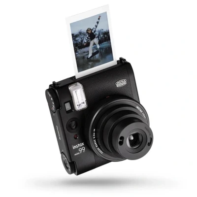 Image of instax mini 99 instant film camera with Colour effect and brightness control, Landscape/Normal/Macro modes, a manual Vignette switch, uses Sold Separately