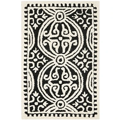 Image of SAFAVIEH Medallion Rug for Living Room, Dining Bedroom Cambridge Collection, Short Pile, in Black and Ivory, 91 X 152 cm