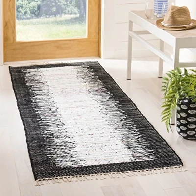 Image of SAFAVIEH Modern Rug for Living Room, Dining Bedroom Montauk Collection, Short Pile, in Ivory and Black, 69 X 213 cm