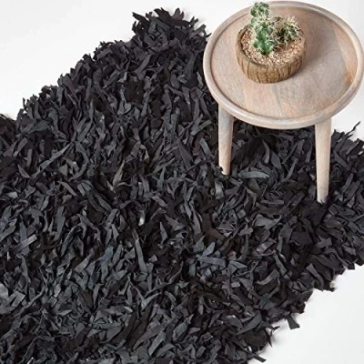 Image of HOMESCAPES Dallas Black Grey 120 x 180 cm (4 6 ft) Modern Designer Real Leather Shaggy Rug Cuts