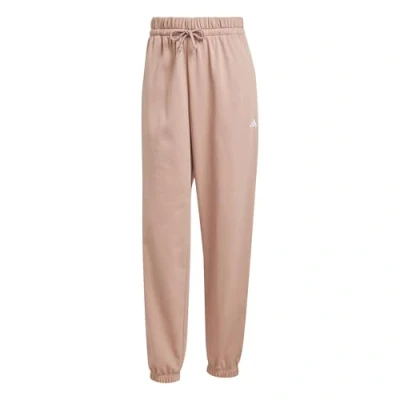 Image of adidas Sportswear Essentials Small LOGO Cuffed Tracksuit bottoms, Women&#039;s, Size: XS, Warm clay/white