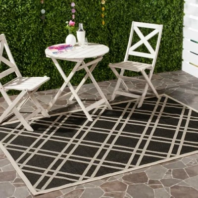 Image of SAFAVIEH Trellis Rug for Indoor &amp; Outdoor Courtyard Collection, Short Pile, in Black and Beige color, 160 X 231 cm