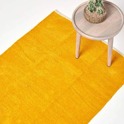 Image of HOMESCAPES Mustard Yellow Rug 100% Cotton Plain Modern Reversible Chenille Floor Mat with Natural Colour Trim Anti Shedding Soft Touch Washable, Extra Large, 110 x 170 cm (43&quot; 67&quot;)