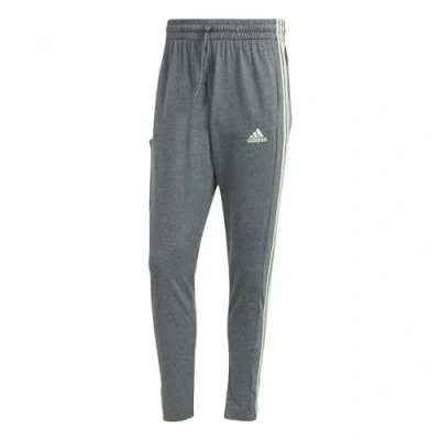 Image of adidas Men&#039;s Essentials Single Jersey Tapered Open Hem 3 Stripes Pants, Dark Grey Heather, XS