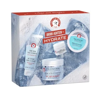 Image of First Aid Beauty Brrr ighten + Hydrate Gift Set Limited Edition Kit with Facial Radiance Exfoliating Pad, Pure Skin Face Cleanser, Eye Duty Brightening Cream Ultra Repair Moisturizer