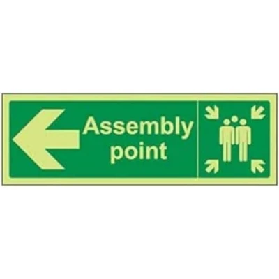 Image of VSafety 17033AX G&quot;Fire Assembly Point Arrow Left&quot; Sign, Glow In Dark, 1 mm Plastic, Landscape, 300 x 100 mm, Green