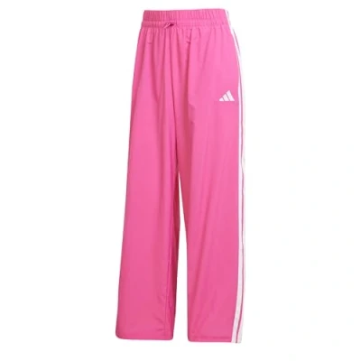 Image of adidas Sportswear Essentials Stripes Lifestyle Parachute Tracksuit bottoms, Women&#039;s, Size: Large, Semi lucid fuchsia white
