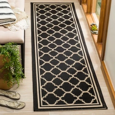 Image of SAFAVIEH Trellis Rug for Indoor &amp; Outdoor Courtyard Collection, Short Pile, in Black and Beige color, 69 X 244 cm
