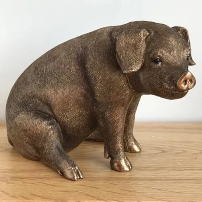 Image of Animal Crackers Sitting Pig figurine from the Leonardo Bronzed Reflections range, aged bronze effect finish, gold gift box