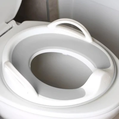 Image of Jool Baby Potty Training Seat for Boys and Girls with Handles, Fits Round &amp; Oval Toilets, Non Slip Splash Guard, Includes Free Storage Hook (Gray)