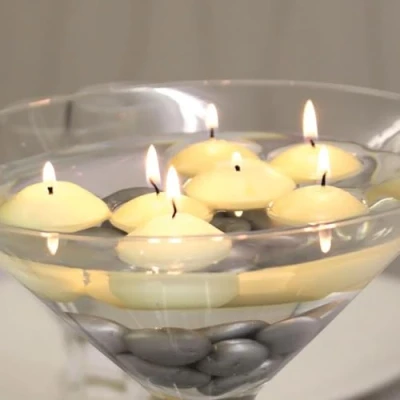 Image of Wenzel maxi floating candles, pack of 8, large and with a long burn time 8 hours off white