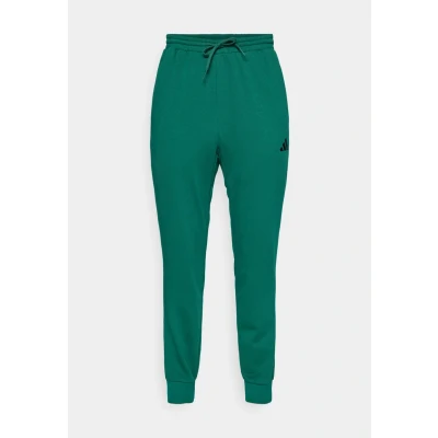 Image of adidas Sportswear Essentials FEEL COZY Tracksuit bottoms, Men&#039;s, Size: XS, Collegiate green/black