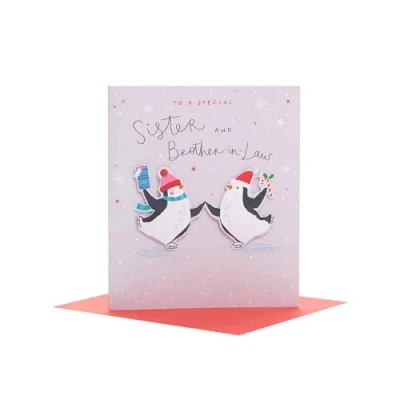 Image of UK Greetings Christmas Card for Sister and Brother in Law Ice Skating Penguins Design