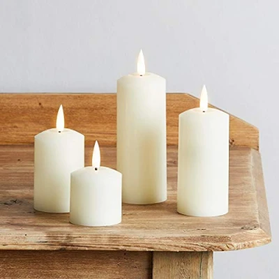 Image of Lights4fun Set of 4 TruGlow® Battery LED Flameless Skinny Pillar Candles with Timer Real Ivory Wax