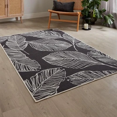 Image of Fusion Charcoal Tropical Leaf Rug (180 x 120cm) Low Pile (Hypoallergenic) Machine Washable Non Slip in Grey with Botanical Leaves for Living Room &amp; Bedroom Decor