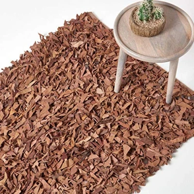Image of HOMESCAPES Dallas Brown/Tan 120 x 180 cm (4 6 ft) Modern Designer Real Leather Shaggy Rug Cuts