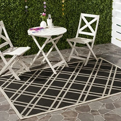 Image of SAFAVIEH Trellis Rug for Indoor &amp; Outdoor Courtyard Collection, Short Pile, in Black and Beige color, 79 X 152 cm