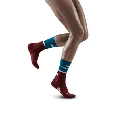 Image of CEP THE RUN compression socks MID CUT for women Medium length running in teal/dark red with Regenerating Size III M
