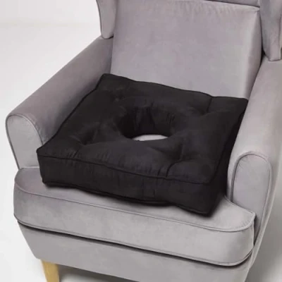 Image of HOMESCAPES Ultimate Comfort Coccyx Cushion for Tailbone Pain Relief Handmade Donut Pillow with Firm Support, Sciatica Relief, Hemorrhoid Black Faux Suede Armchair Booster