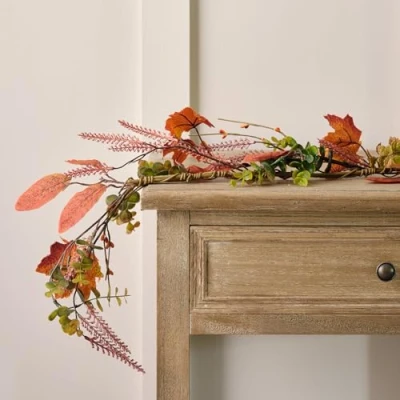Image of Lights4fun 1.5m Artificial Mix Orange Leaf Autumn Foliage Garland Indoor Decoration