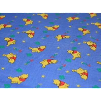Image of Polycotton Printed Dress Fabric with Blue Winnie the Pooh Design 114.3 cm per metre