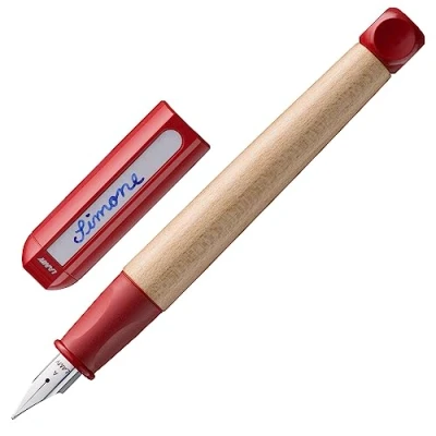 Image of LAMY abc red child friendly Fountain Pen for writing beginners with ergonomic grip &amp; polished Left Handed steel nib (LH) in size M robust maple wood including T 10 blue ink cartridge
