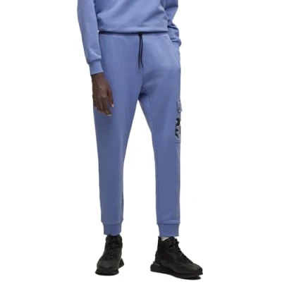 Image of HUGO Mens Dobcat Cotton terry tracksuit bottoms with camouflage artwork