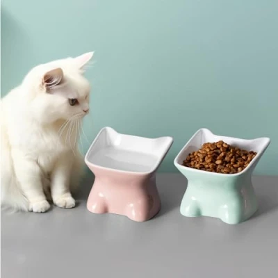 Image of Navaris Raised Ceramic Cat Bowls (Set of 2) Elevated Food and Water Bowl Pack for Cats Cute Kitty Shaped Dishes with Ears Dishwasher Safe Green/Peach