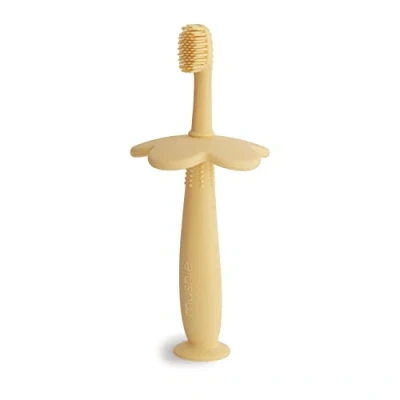 Image of Mushie Silicone Training Toothbrush for Infants and Toddlers Suction Base Easy Storage &amp; Material: Food Grade Flower Design (Pale Daffodil)