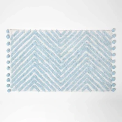 Image of HOMESCAPES Blue Cotton Bath Mat with Zig Zag Design Super Absorbent Tufted Bathmat Pom Poms, 50 x 80 cm