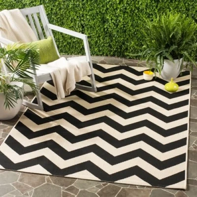 Image of SAFAVIEH Chevron Rug for Indoor &amp; Outdoor Courtyard Collection, Short Pile, in Black and Beige color, 122 X 170 cm