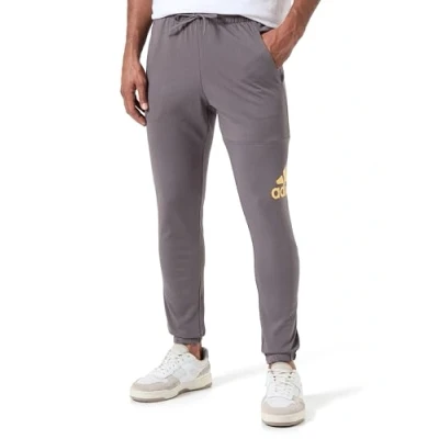 Image of adidas Men&#039;s Essentials Single Jersey Tapered Badge of Sport Pants, Charcoal, L