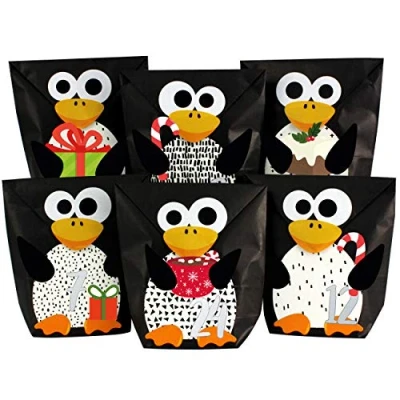 Image of Papierdrachen DIY advent calendar to fill pre cut penguins with 24 black paper bags and make yourself Christmas 2021 for kids