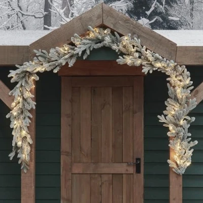 Image of Lights4fun 2.5m Dual Lit Artificial Snowy Outdoor Battery Operated Christmas Garland