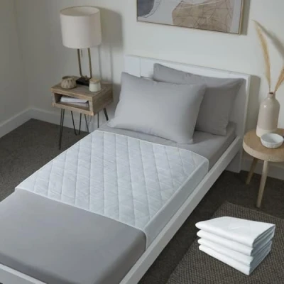 Image of Waterproof bed pad with tucks Washable wetting sheet for adults or children incontinence Reusable mat Discreet white