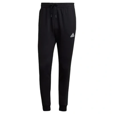 Image of adidas Sportswear Essentials Tapered Tracksuit bottoms, Men&#039;s, Size: XS, Black/white