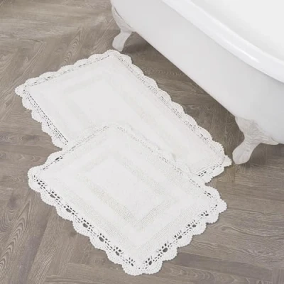 Image of Laura Ashley Crochet Cotton 17x24/21x34 in. 2 Piece Bath Rug Set, Creamy White