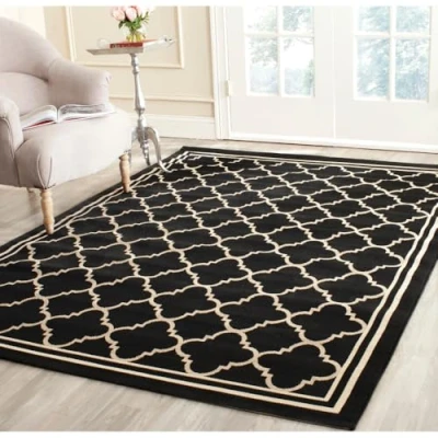 Image of SAFAVIEH Trellis Rug for Indoor &amp; Outdoor Courtyard Collection, Short Pile, in Black and Beige color, 122 X 170 cm