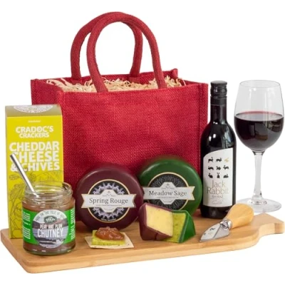 Image of InterHamper Cheese and Wine Treat Hamper Gift with Red Wine, Truckles, Chutney Crackers all presented in a Jute Bag