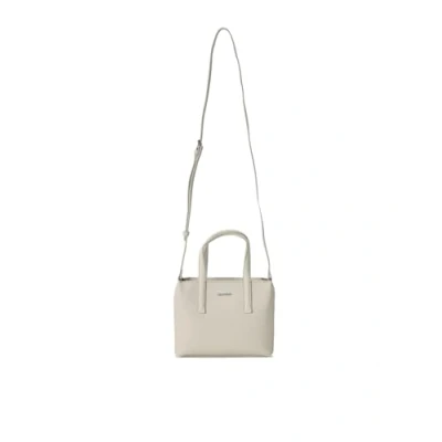 Image of Calvin Klein Women&#039;s Ck Must Mini Tote_pu/Nubuck K60k611873 Crossovers, Grey (Dk Ecru), One Size