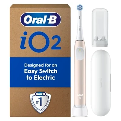 Image of Oral B iO2 Calm Pink Electric Toothbrush, 1 Toothbrush Head, Travel Case, Refill Holder, Designed by Braun