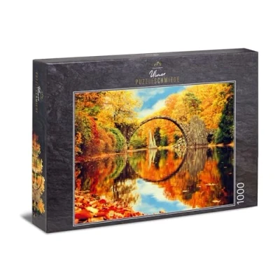 Image of Ulmer Puzzleschmiede puzzle Fairytale Forest 1000 pieces jigsaw Rakotzbrücke Kromlau in Germany with perfect reflection the lake
